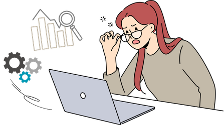 PCでデータ分析に悩む眼鏡の女性
